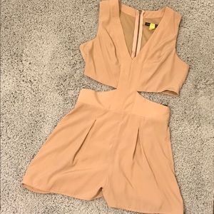 Nude color romper with sides cut out